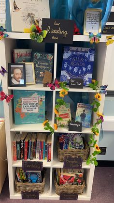 the bookshelf is filled with children's books and other things to read