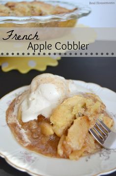 a white plate topped with an apple cobbler and ice cream on top of it