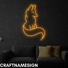 a wall with a neon sign that says craftmaesign on it and a couch in the background