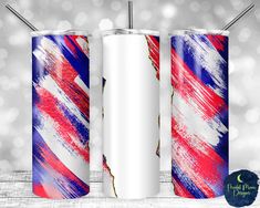 two red, white and blue tumblers with straws in front of silver boke