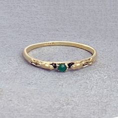 This is a lovely 14k gold ring featuring two tiny frogs holding a natural precious Imperial jade from Canada. I have made this original timeless design since the early 1960's. This is a dainty ring, the face of the ring measures just 1/2" inch length and the tiny round jade is 2mm in diameter. Handmade to order.  Message us if you would like this ring in white, rose or 18k gold, with an opal instead of jade, or a size not offered. We also have this ring available with a tiny natural white seed pearl: https://janpalombodesign.etsy.com/listing/1471565751/frogs-and-pearl-ring-in-14k-gold-tiny Elegant Gold Jade Ring, Unique Round Jade Ring, Heirloom Jade Rings In Yellow Gold, Heirloom Green Jade Rings, Vintage Round Jade Rings, Tiny Frogs, Frog Ring, Imperial Jade, Vintage Style Rings