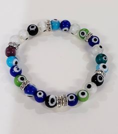 Evil Eye 8mm round protection Bracelet, stretchy with rhinestones roundel or without rhinestone. Man's woman gift, Chakra Protection Bracelet, Watermelon Tourmaline, Jewelry Making Supplies, Pandora Charm Bracelet, Evil Eye, Fashion Bracelets, Necklaces Bracelets, Chakra, Gifts For Women