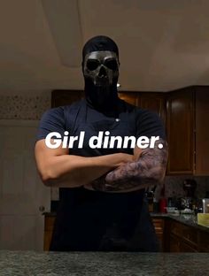 a man wearing a black mask and holding his arms crossed with the words girl dinner on it