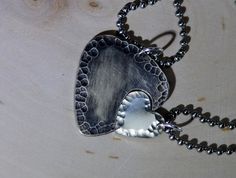 Sterling silver guitar pick and heart couples by NiciLaskin Music-themed Heart-shaped Jewelry Gift, Music And Love, Couples Necklaces, Guitar Pick Necklace Aesthetic, Guitar Pick Jewelry Necklace, Nickel-free Silver Music-themed Necklaces, Guitar Pick + Necklace Cheap, Silver Guitar, Dainty Necklace Layered