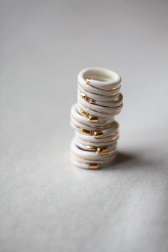 Noun is a modern, minimalist ring with clean lines. Made of Limoges porcelain, hand-painted with liquid gold. Each piece is delicately made, and cooked at high temperature to fortify it. It is resistant, but remember, porcelain is a delicate material that must be worn carefully in order to avoid any shock with hard objects or surfaces. Noun es tune River of Morocco To metropolitan France, your order will be sent by COLISSIMO. It will be issued against a signature, a tracking number will be issue White Stackable Enamel Jewelry, White Enamel Stackable Ring, White Stackable Enamel Ring, Modern White Enamel Jewelry, White Stackable Rings For Everyday, Everyday Stackable White Rings, Everyday White Stackable Rings, White Enamel Ring For Gift, White Ceramic Jewelry For Gifts