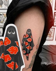 a person with a tattoo on their arm and some stickers in front of them