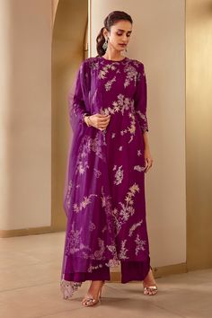 Aubergine straight kurta with floral applique work and sequin embroidery. Comes with palazzo and embroidered dupatta.
Component: 3
Pattern: Embroidery
Type Of Work: Applique Work, Thread and Sequin
Neckline: Round
Sleeve Type: Three Quarter
Fabric: Mulberry Silk
Color: Purple
Other Details: 
Cutwork detail on the neckline and sleeve hems
Side slits
Dupatta with embroidery and scallop border
Closure: Side zip
Occasion: Wedding - Aza Fashions Kurta Palazzo Set, Scallop Border, Kaftan Designs, Applique Work, Latest Dress Design, Kurta Set For Women, Salwar Designs, A Line Kurta, Palazzo Set