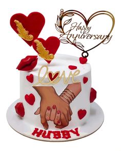 a happy anniversary cake with two hands holding each other's hand and hearts on top