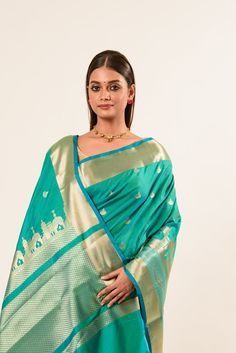 Discover the exquisite light Blue Temple Border Handwoven Katan Banarasi Saree. Perfect for saree enthusiasts, this elegant piece blends tradition with style. Shop now and elevate your collection! Turquoise Saree For Wedding With Traditional Drape, Elegant Turquoise Saree For Diwali, Turquoise Wedding Saree In Traditional Drape, Elegant Turquoise Saree For Festivals, Elegant Turquoise Dupatta With Zari Work, Elegant Turquoise Dupatta For Festive Occasions, Turquoise Banarasi Silk Traditional Wear With Cutdana, Elegant Turquoise Dupatta For Diwali, Traditional Turquoise Wear With Zari Weaving