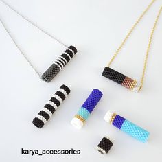 four different types of necklaces on a white surface with the words karya accessories written below them