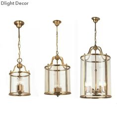 three light fixtures hanging from the ceiling in different sizes and colors, one is gold