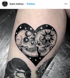 a couple of skulls in the shape of a heart with stars and moon on it