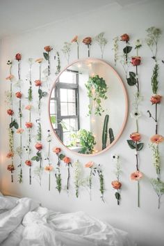 there is a mirror with flowers on it and the words happiness are in front of it