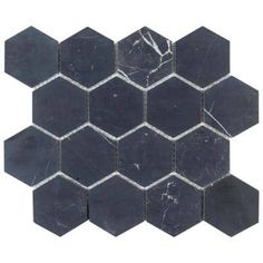 black marble hexagon tiles with white veining on each side and one in the middle