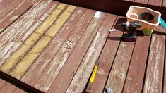 the tools are sitting on the wooden deck