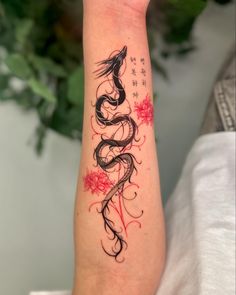 a woman's arm with a tattoo design on it