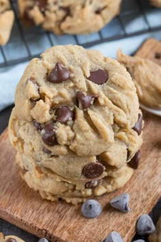 chocolate chip cookies are stacked on top of each other with one cookie in the middle