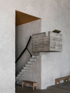 the stairs are made out of concrete and wood