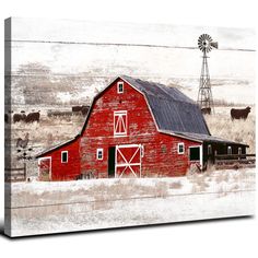 a red barn with a windmill in the background