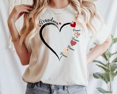 Personalized Grandma Shirt ,Custom Grandma Gift, Grandma Heart Shirt, Funny Grandma Shirt, Mothers Day Gift, Grandma Birthday Gift, Grandma  ⭐Please Check All Photos For Details.   🐞Choose Your T-Shirt Size From The Drop-Down Lists Next To The item Picture   ⭐Choose Of Your T-Shirt Color From The 2nd Picture   🐞Use "Add message to Seller" link On The Checkout Page To Send me the Following important Details For Your Order's Customization.   ⭐Shipping Time Varies by location (we are located in S Funny Grandma Shirts, Grandma Birthday Gift, Funny Grandma, Birthday Gifts For Grandma, Grandma Birthday, Grandma Shirt, Personalized Grandma, Grandma Shirts, Grandma Gift