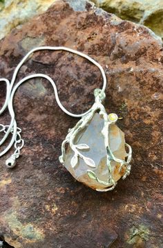 "This beautiful, two tone, rough-cut citrine quartz stone is wire wrapped in .925 silver. chain is silver plated and 16\" long, pendant is 1.5\" long and 1/2\" wide with a 2\" extender chain and a lobster clasp." Stone Pendant Necklace, Long Pendant, Wrapped Pendant, Wire Wrapped Pendant, Stone Pendant, Quartz Stone, Rough Cut, Stone Pendants, Wire Wrapped