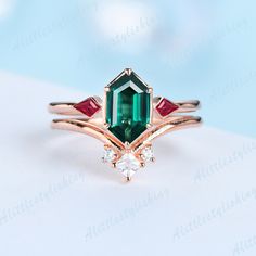 Emerald Ruby Wedding Ring Set, Art Deco Emerald Engagement Ring, Bridal Set, Unique Curve Wedding Band ❈Item detail❈ ✼Engagement ring: -Main stone: 5x9mm Long Hexagon cut Lab created Emerald -Side stones: Kite Cut 0.22ct Lab created Ruby -Material:925 sterling silver/ white gold plated/ rose gold plated / yellow gold plated / 10K/14K/18K solid gold available ✼Wedding band: -Stones: Princess & Round cut 0.15ctw Moissanite stones -Material:925 sterling silver/ white gold plated/ rose gold plated / Emerald-cut Diamond Ring For Wedding, Emerald-cut Diamond Wedding Ring, Art Deco Green Diamond Ring For Wedding, Emerald Cut Emerald Wedding Ring, Art Deco Emerald Wedding Ring For May Birthstone, Art Deco Emerald Wedding Ring May Birthstone, Art Deco Green Diamond Wedding Ring, Green Diamond Crystal Ring For Wedding, Emerald Marquise Cut Diamond Wedding Ring