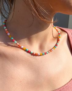 This beaded multicolor choker is a perfect brightening up any outfit. Dress it up for a more elegant night out, or wear it casually for a chic, beachy look. It can be a great gift for her or for yourself.  It has a lobster clasp closure and an extension chain allowing for easy adjustability and remove. Necklace Length: 17 inch (with 1 inch extender to make the necklace adjustable to 18 inches) Handmade Beaded Necklace Closure: Lobster Claw  Adjustable length Necklace Care: Avoid wearing in water or to sleep to keep the necklace in the best shape. Overtime, the clasp and chain may begin tarnish. Festival Letter Beads, Trendy Multicolor Letter Beads Choker, Trendy Beaded Necklaces With Round Beads, Colorful Beaded Necklaces With Letter Beads, Bohemian Choker Necklace With Letter Beads, Bohemian Letter Beads Choker Necklace, Colorful Letter Beads Necklace, Multicolor Beads For Summer Jewelry Making, Summer Letter Beads Choker Necklace