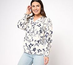 This pullover-style blouse is elevated with a beautiful chinoiserie pattern, while the smocking and ruffle detail along the cuff adds ladylike charm. From Belle by Kim Gravel. Feminine Tops With Smocked Bishop Sleeves, Casual Blouse With Floral Print And Bishop Sleeves, Casual Floral Print Top With Bishop Sleeves, Chic Tops With Floral Print And Bishop Sleeves, Elegant Floral Print Blouse With Bishop Sleeves, Daywear Top With Blouson And Ruffle Sleeves, Chinoiserie Print, Chinoiserie Pattern, Valerie Parr Hill