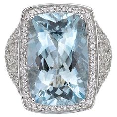 This collection features an array of aquamarines with an icy blue hue that is as cool as it gets! Accented with diamonds these rings are made in white gold and present a classic yet elegant look. Classic aquamarine ring in 18K white gold with diamonds. Aquamarine: 11.8 carat cushion shape, 18x12mm. Diamonds: 0.672 carat, G colour, VS clarity. Gold: 8.2g, 18K white gold. Ring Size: US 6.75 - Size can be adjusted for free upon request - please reconfirm with your order. R565 Gold Cocktail Ring, Gold Cocktail, Aquamarine Ring, Sky Blue Topaz, Naha, Icy Blue, Green Sapphire, Birthstone Jewelry, White Gold Rings