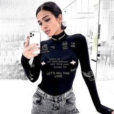 Brand New Boutique Item. Black Long Sleeve Bodysuit With A Turtleneck Neckline And A 3 Snap Button Closure At The Bottom. Features White Graphics Of Angels, Flames, Etc. & Words/Phrases Printed All Over Such As "Let's Kill This Love", “Turn Up Party”, “F**K This World” & “Enjoy The Game”. See Pictures For Details. Sexy, Stretchy & Form Fitting. Material: Polyester & Spandex Note: Runs Rather Small, I Recommend Buying 1 Size Up From Your Usual Size! Small: Bust: 29.9-33.8” Sleeve: 25.6” Waist: 23.6-25.9” Medium: Bust: 31.5-35.4” Sleeve: 25.9” Waist: 25.2-27.5” Large: Bust: 33-37” Sleeve: 26.4” Waist: 26.7-29.1” Trendy Black Bodysuit For Club, Trendy Black Club Bodysuit, Casual Long Sleeve Graphic Bodysuit, Trendy Graphic Print Stretch Bodysuit, Trendy Stretch Bodysuit With Graphic Print, Black Fitted Punk Bodysuit, Casual Fitted Bodysuit With Letter Print, Fitted Casual Bodysuit With Letter Print, Fitted Black Punk Bodysuit