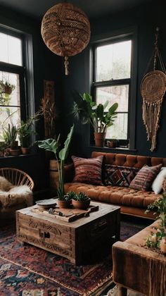 a living room filled with lots of furniture and plants