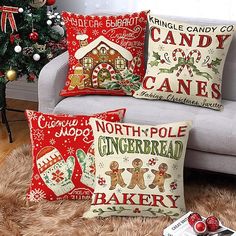 three christmas pillows on a couch in front of a christmas tree and candy canes