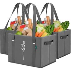 three gray grocery bags filled with vegetables