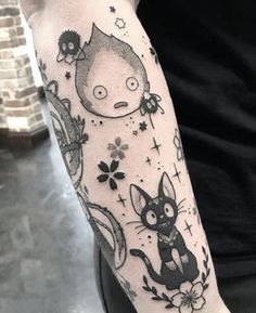 a person with a cat tattoo on their arm