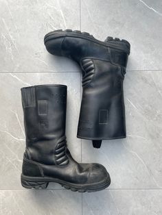 1960s Vintage Fireman Boots  Color: Black  ⌖ Heavy-duty leather ⌖ shaft seams ⌖ Safety steel toe ⌖ leather ankle padding ⌖ Heat-resistant, slip-resistant Nitrile rubber ⌖ shell outsole with air chamber damping ⌖ Pull-on loops ⌖ Height: 13″ Please note all items are examined to the best of our ability. Most items are 20+ years old and are not in perfect condition small imperfections are to be expected any major flaws will be disclosed. Leather Combat Moto Boots With Reinforced Toe, Combat Style Waterproof Leather Boots With Steel Toe, Leather Combat Boots With Protective Design For Streetwear, Vintage Steel Toe Work Boots, Combat Leather Boots With Vibram Sole, Industrial Leather Work Boots With Steel Toe, Combat Leather Moto Boots With Steel Toe, Leather Combat Boots With Protective Features For Outdoor Work, Combat Boots With Vibram Sole In Leather