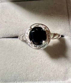 Gemstone:  genuine natural round cut black spinel Size: 8mm x 8mm Weight: 2.05cts approximately  Metal: .925 stamped Sterling Silver, rhodium plated Size: 10 Classic Black Sapphire Ring In Sterling Silver, Black Sapphire Round Jewelry, Classic Black Oval Sapphire Ring, Classic Black Sapphire Oval Ring, Fine Jewelry Black Spinel Sapphire Ring, Black Sapphire Fine Jewelry, Black Birthstone Rings, Black Oval Center Stone Jewelry, Classic Black Spinel Sapphire Ring For Anniversary