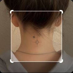 a woman's neck with a small star tattoo on her left side ribcage