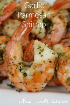 garlic parmesan shrimp on a white plate with the words garlic parmesan shrimp