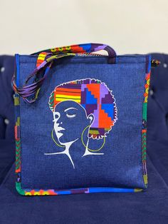 Made by Africa's finest, the cutest most durable tote bag with African print embellishment and embroidery. Whwt makes this bag unique is the fact that this bag is furnished with embroidered images of African beautiful women and embellished with strong vibrant African Print Fabric. This cotton vibrant African Fabric is also used around the rest of the bag which includes the handles.  This tote bag can be used for every day use, to the beach, to lectures, brunch afternoons, church, work. It can fi Rectangular Embroidered Canvas Bag, Embroidered Rectangular Canvas Bag, Blue Embroidered Canvas Bags, Blue Embroidered Rectangular Canvas Bag, Embroidered Fabric Tote Bag, Fabric Shoulder Bag Suitable For Gifts, Fabric Shoulder Bag For Gifts, Fabric Shoulder Bag For Gift, Fabric Tote Gift Bag