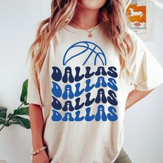 Comfort Colors Dallas Basketball Shirt, Dallas Basketball Sweatshirt, Vintage Style Dallas Basketball shirt, Dallas Basketball fan Gift -Please check Color and Size Charts before placing the order. You can find them in the listing's photos (Depending on what device you are viewing this listing colors may vary slightly). -Returns and exchanges are accepted only if there are defects "No Extra Costs" We create custom t-shirts with great designs for everyone's liking. If you don't find the size or c Fraternity Shirts Basketball, Vintage Basketball Shirts, Basketball Shirt Designs Ideas, Retro Cotton Tops With Team Logo, Retro Cotton Top With Team Logo, Sports Fan Cotton Shirt With Graphic Print, Casual Cotton Shirt With Team Logo, Dallas Basketball, Basketball Shirt Designs