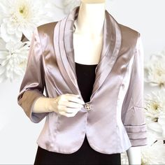 Short Dressy Jacket. Shiny Silver. 3% Spandex Gives Some Stretch To The Fabric. Has Swen In Shoulder Pads. Can Easily Be Removed. Sparkly Button Front Closure. 3/4 Sleeves. New With Tags. Elegant Stretch Outerwear For Spring, Stretch Blazer For Spring Formal Occasions, Spring Formal Stretch Blazer, Spring Formal Stretch Outerwear, Dressy Jacket, Silver Blazer, Bride Jacket, Chiffon Cover Up, Dressy Jackets