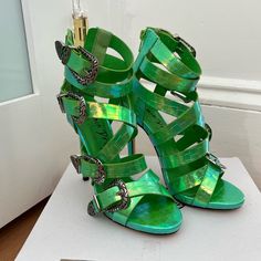 Brand New And Never Worn In Original Box. Size 7. Iridescent Open Toe Heels For Party, Iridescent Round Toe Heels For Party, Iridescent High Heel Party Heels, Glamorous Green High Heels, Metallic High Heel Heels For Cocktail, Metallic High Heels For Cocktail, Metallic High Heels For Cocktail Events, Elegant Iridescent Heels For Evening, Glamorous Iridescent Heels For Evening