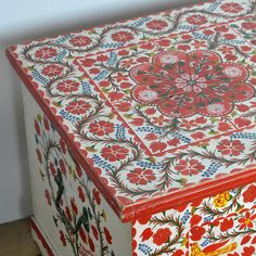 an ornately painted box sits on the floor