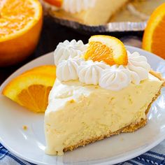 a slice of cheesecake on a plate with oranges