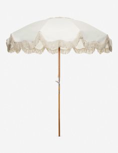 an umbrella with tassels on it is shown in front of a white background