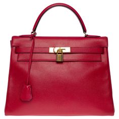 Amazing Hermes Kelly 32 retourné handbag strap in Red Courchevel leather, gold plated metal hardware, red leather handle, removable shoulder strap in red leather for a hand or shoulder carry Flap closure red leather lining, one zippered pocket, two patch pockets Signature: "Hermès Paris Made in France" Date: S circle (1989) Dimensions: 32 x 23 x 12 cm (12.6 x 9 x 4.72 Inches) Reference: 101148 General condition: 6,5/10 Sold with removable shoulder strap, tirette, clochette, padlock and keys In v Hermes Kelly 32, Kelly 32, Hermes Paris, Handbag Straps, Hermes Bags, Metal Hardware, Birkin Bag, Gucci Jackie Bag, Dior Saddle Bag