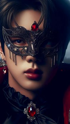 a close up of a person wearing a mask with jewels on their face and eyes