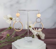 Bronze Gold Dangling Round Earrings. These are beautiful earrings to wear every day! They're lightweight and comfortable, and they add just the right amount of sparkle to any outfit. Trendy Hypoallergenic Rose Gold Earrings, Trendy Hypoallergenic Wedding Earrings, Hypoallergenic Metal Wedding Earrings, Trendy Hypoallergenic Earrings For Wedding, Hypoallergenic Metal Earrings For Wedding, Rose Gold Small Hoop Earrings For Party, Minimalist Cadmium-free Dangle Earrings, Modern Hypoallergenic Rose Gold Earrings, Nickel Free Rose Gold Circle Earrings