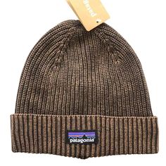 Elevate your cold-weather style with the Patagonia Beanies. Crafted for street wearers adventurers, this cozy headwear combines sustainable warmth with rugged outdoor charm. Made from premium cotton, it's a must-have for eco-conscious explorers. Stay warm, look cool, and embrace sustainable fashion with Patagonia.      Fabric:       100% cotton     One size fit all. Casual Brown Cotton Beanie, Outdoor Cotton Beanie Cap, Casual Beanie For Outdoor, Brown Cotton Winter Hat, Warm Casual Hats For Outdoor, Casual Warm Hat For Outdoor, Brown Outdoor Hats With Fleece Lining, Casual Hats With Fleece Lining, Warm Brown Hats For Outdoor Activities