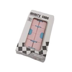 four pink and blue erasers sitting in a box on top of a white surface